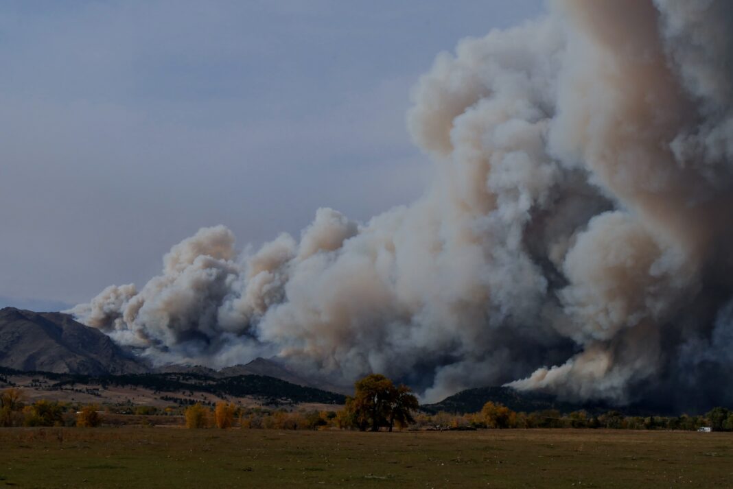 Fire depicted sweeping over terrain